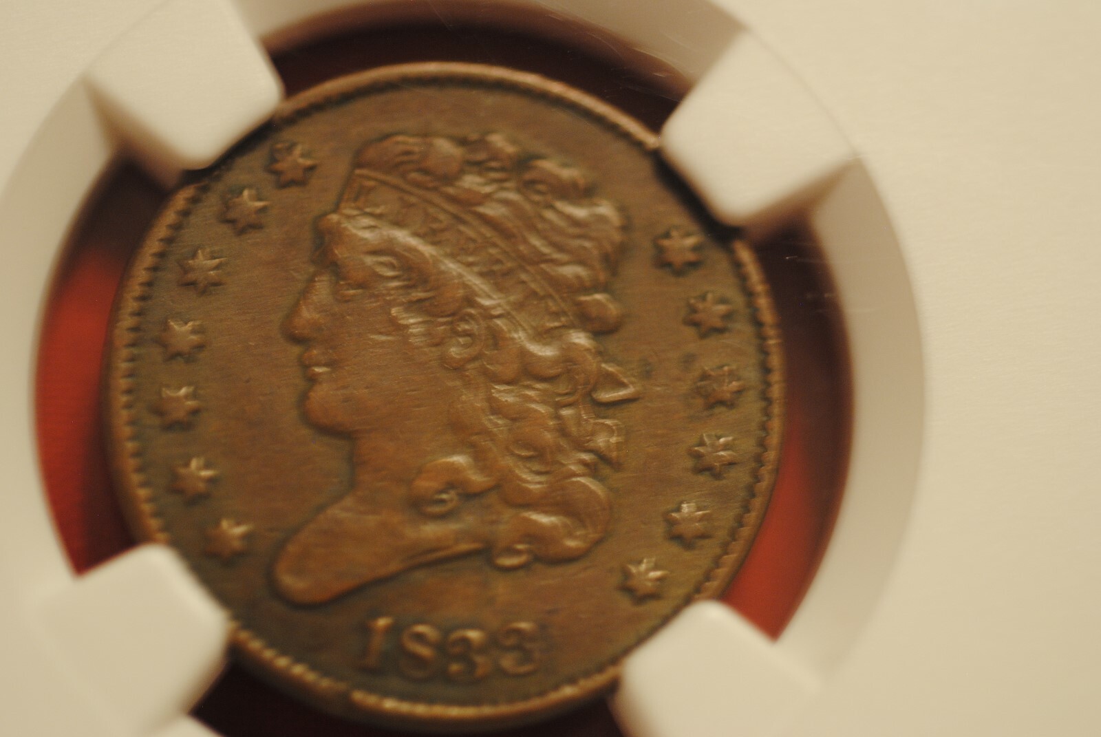 1833 1/2 cent in VF 25 BN NGC