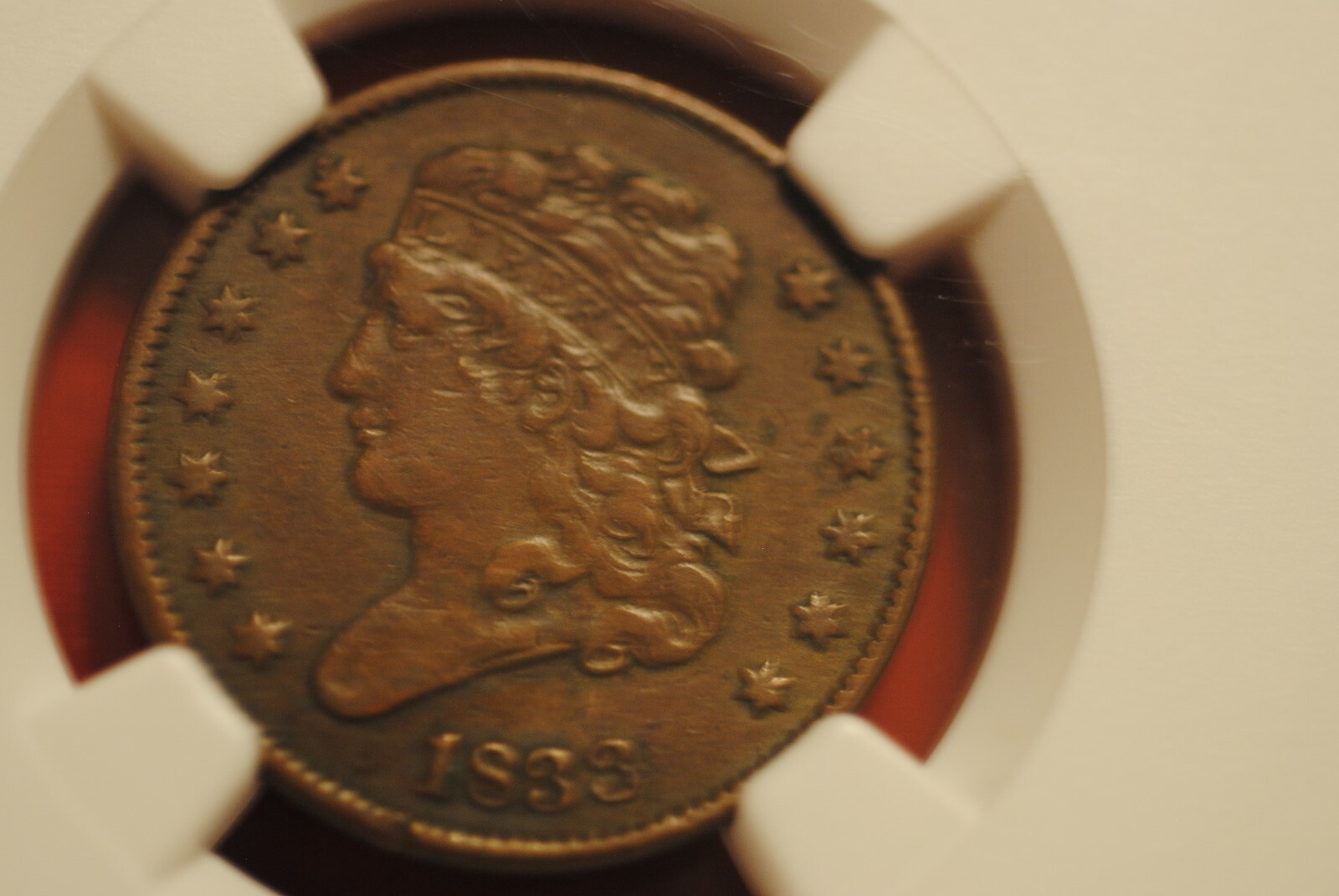 1833 1/2 cent in VF 25 BN NGC