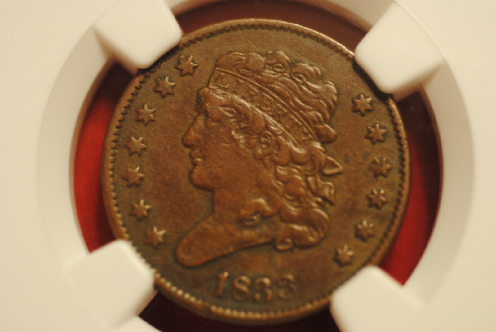 1833 1/2 cent in VF 25 BN NGC