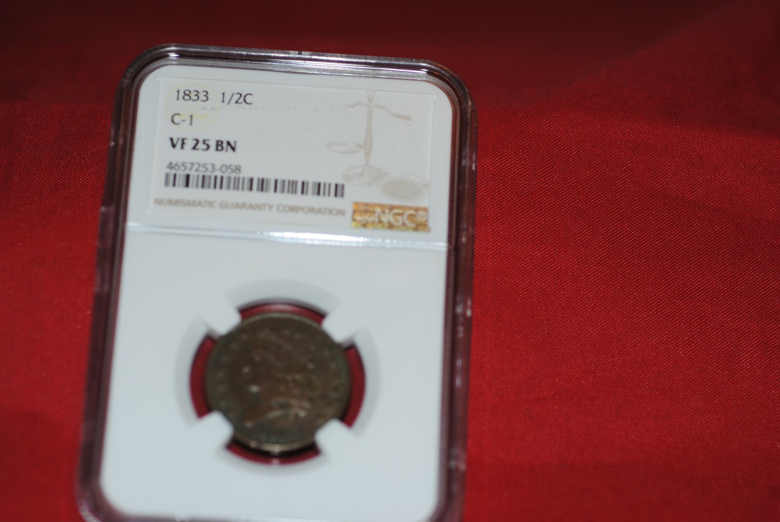 1833 1/2 cent in VF 25 BN NGC