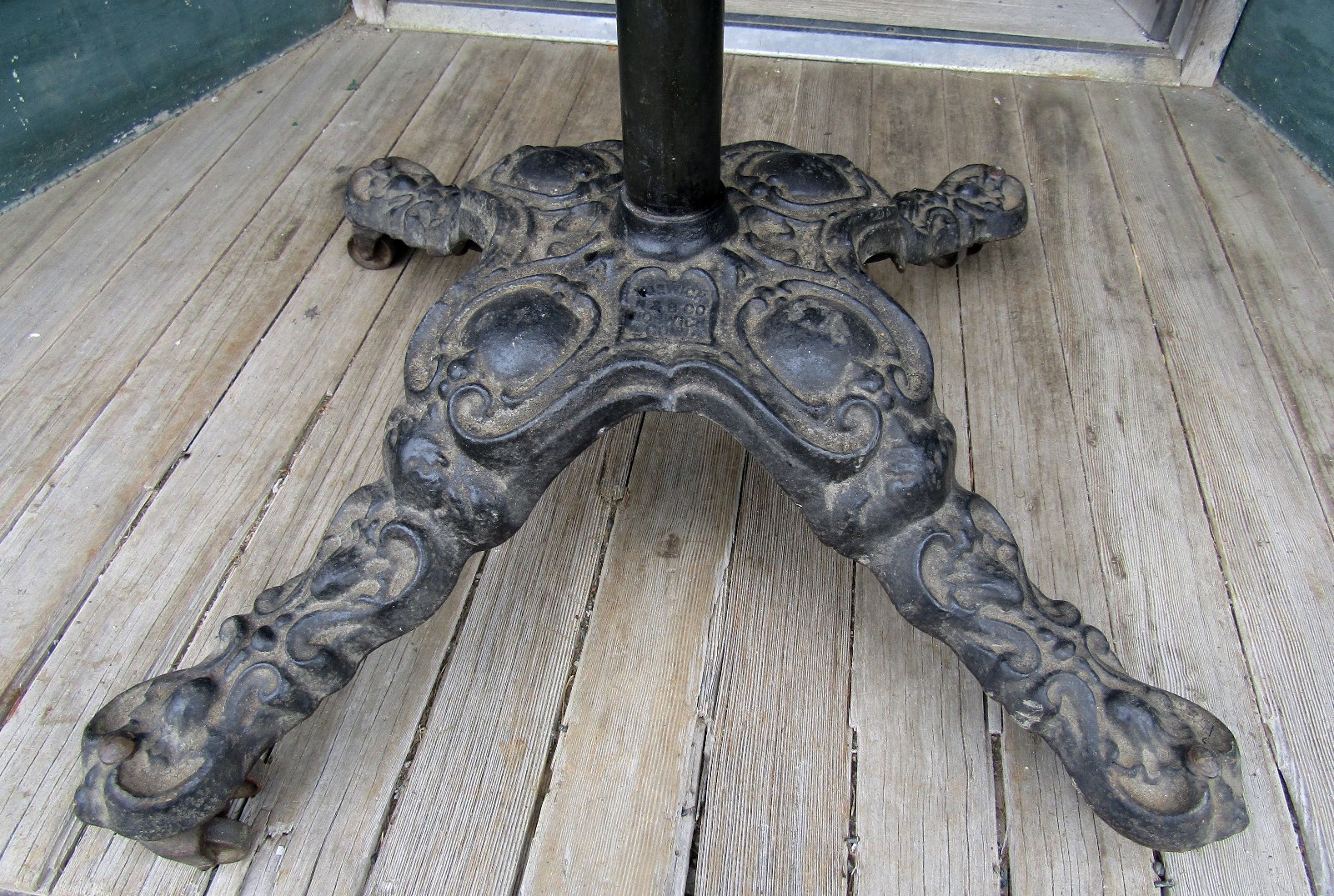 ANTIQUE CAST IRON REVOLVING ROUNDER - CLOTHS RACK