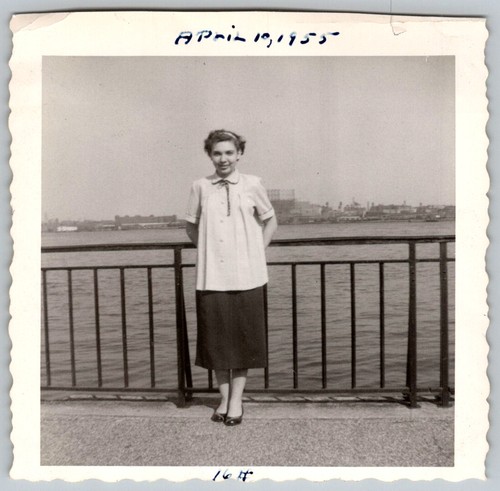 Vtg B&W Snapshot Young Woman Smiling Waterfront Pier City Skyline View 1955