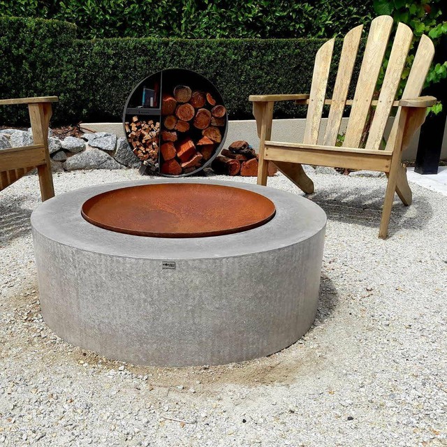 Polished concrete round handmade custom fire pit with rust metal bowl