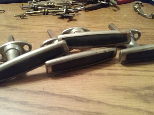 VINTAGE METAL DOOR HANDLES WITH BLACK TRIM SET OF FOUR