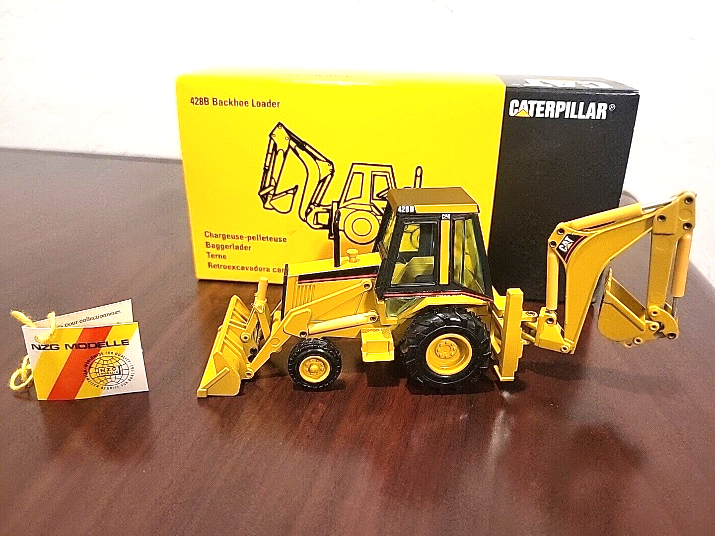 Vintage NZG 2851 Caterpillar CAT 428B Backhoe Loader 1/50 in