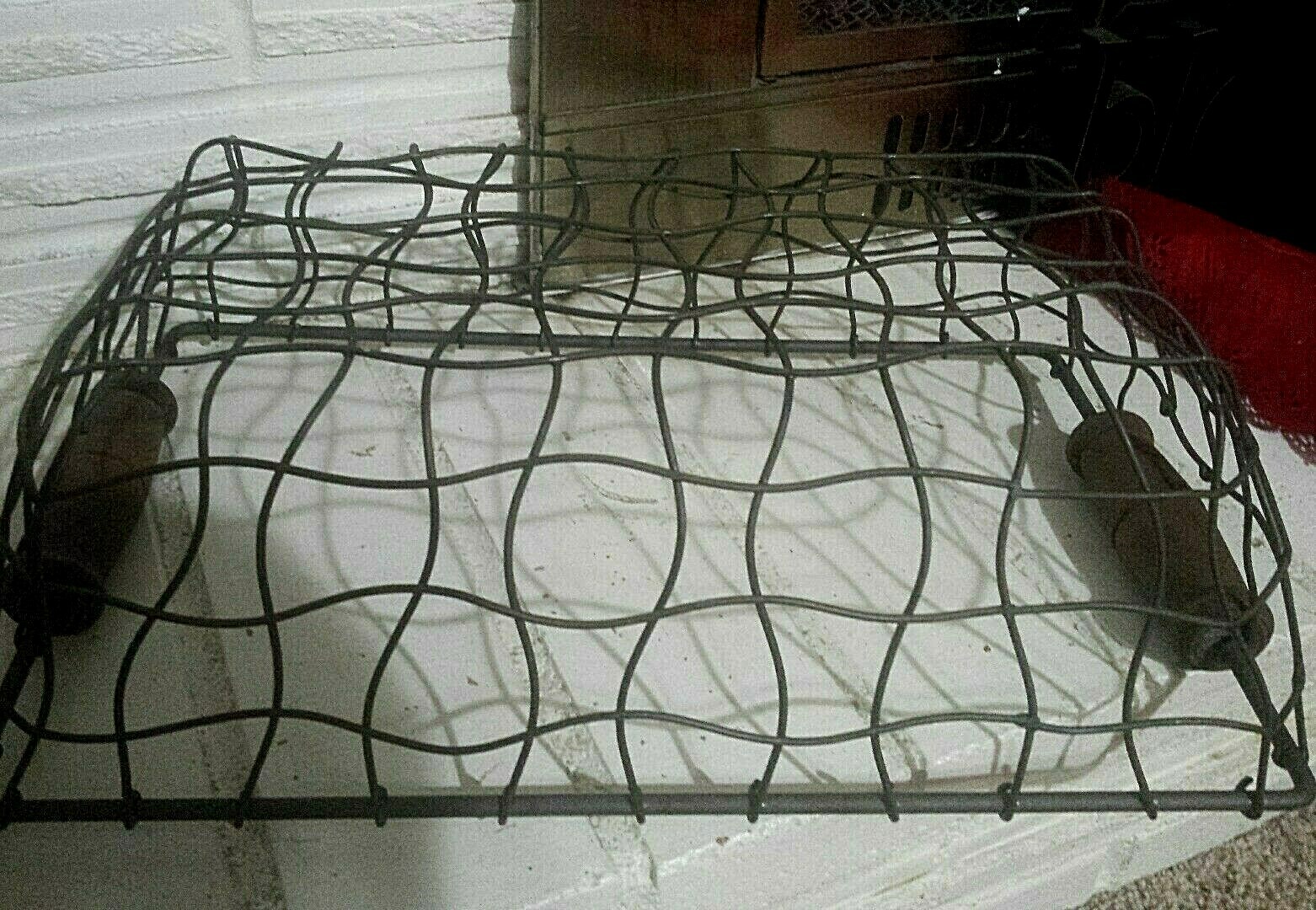 OLD FACTORY? METAL STURDY BASKET, WITH WOOD HANDLE.  VERY UNIQUE WIRE CURVES..