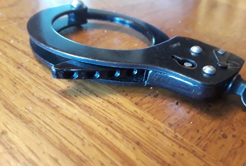 Vintage Black Handcuffs star wheel