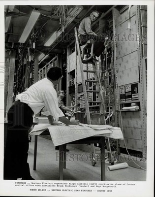 1963 Press Photo Western Electric Supervisor, Installers Work on Corona Office
