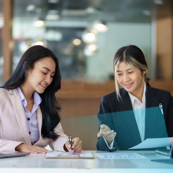 Two professionals collaborating in a business meeting