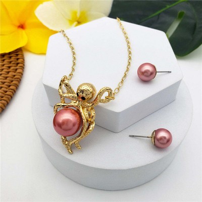 Set Of Pearl Stud Earrings And Octopus Necklace Holding A Pearl In Different Col
