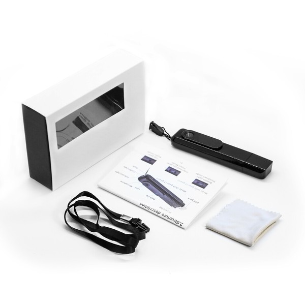 Portable handheld scanner with accessories and packaging.