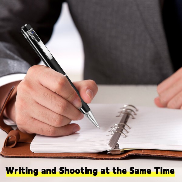 Person using camera pen while writing on notepad.