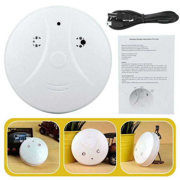 Round white smoke detector with instruction manual.