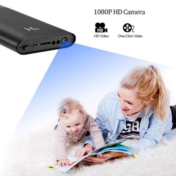 Mother and baby enjoying book, portable HD camera advertised.