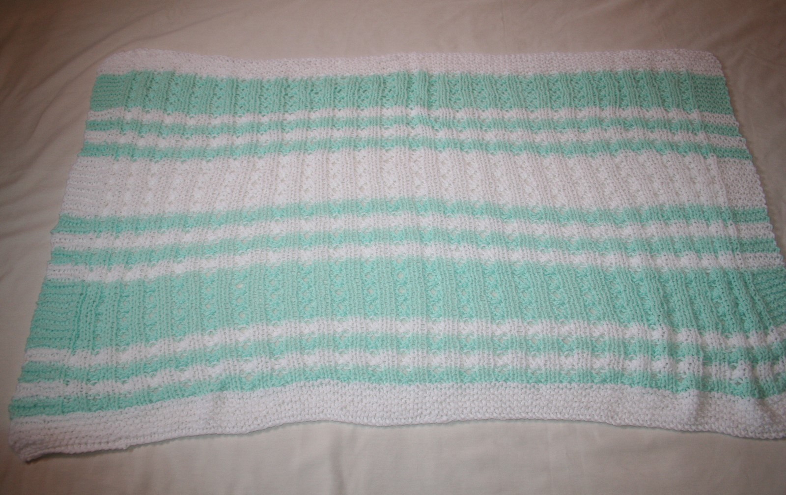 HAND KNITTED WHITE & GREEN BABY BLANKET