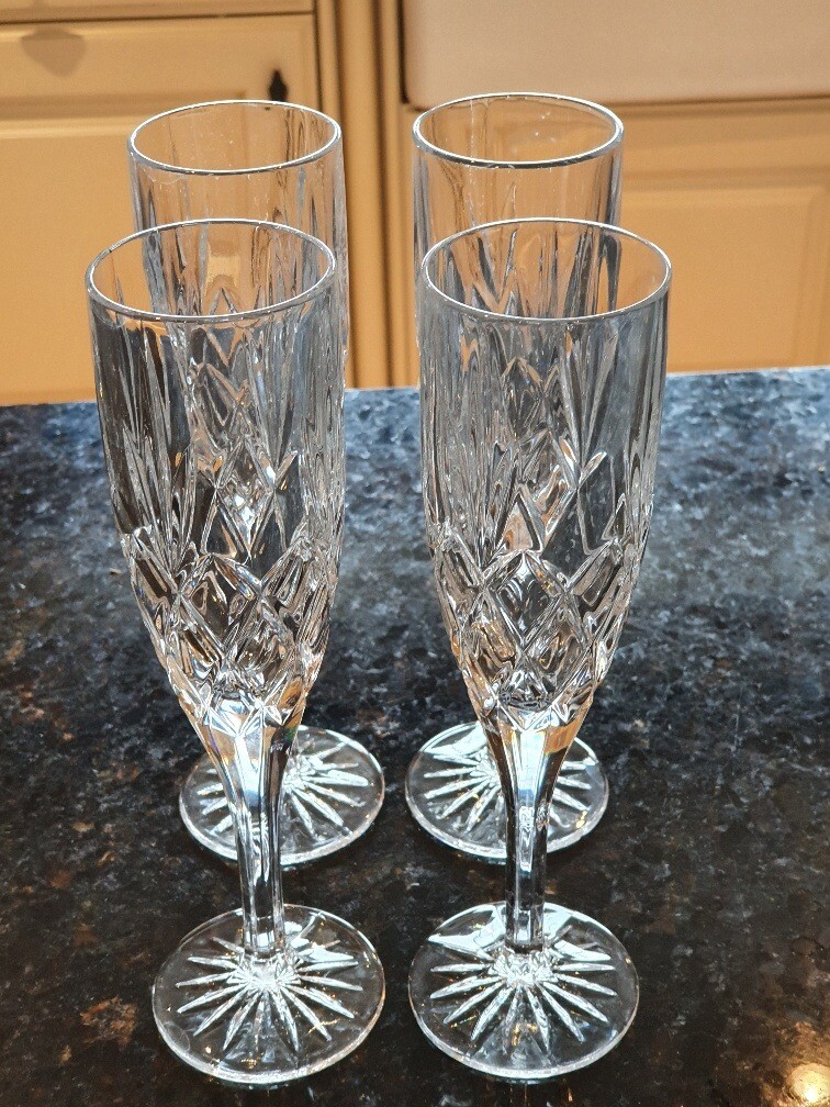 4 cut glass champagne flutes perfect condition in Billericay, Essex