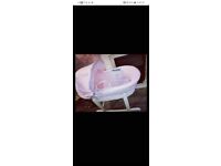 Pink mosses basket with white rocking stand