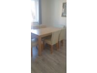 Habitat dining table with six chairs.
