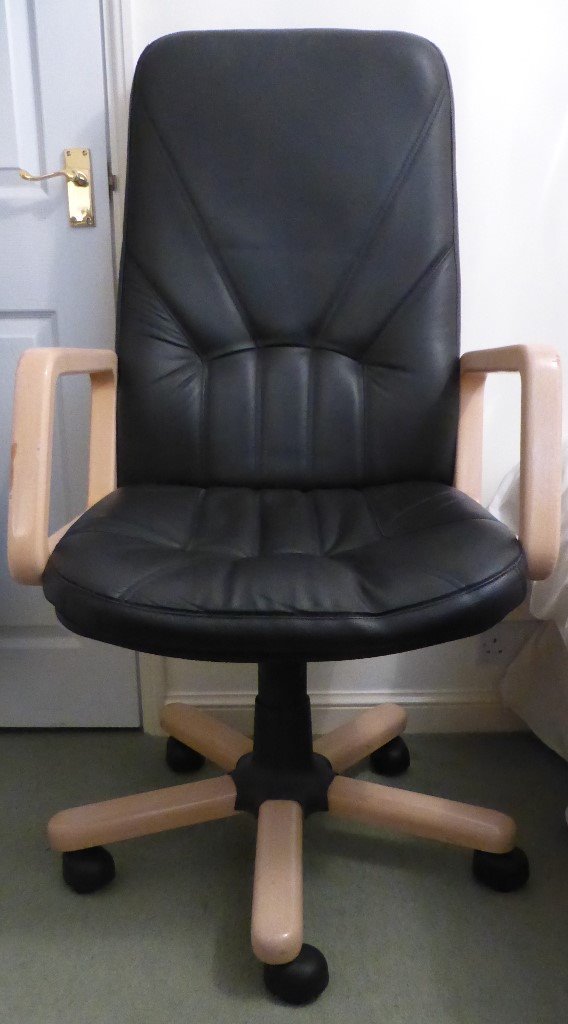 Black leather office chair on castors with height adjustment and tilt