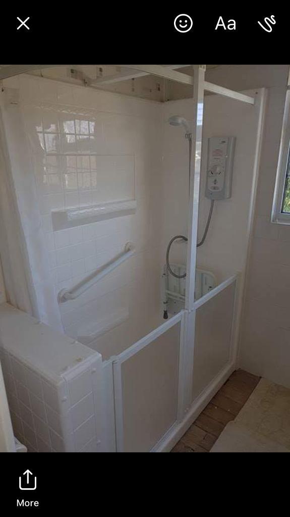 Disabled shower unit with fold down seat and Mira electric shower in