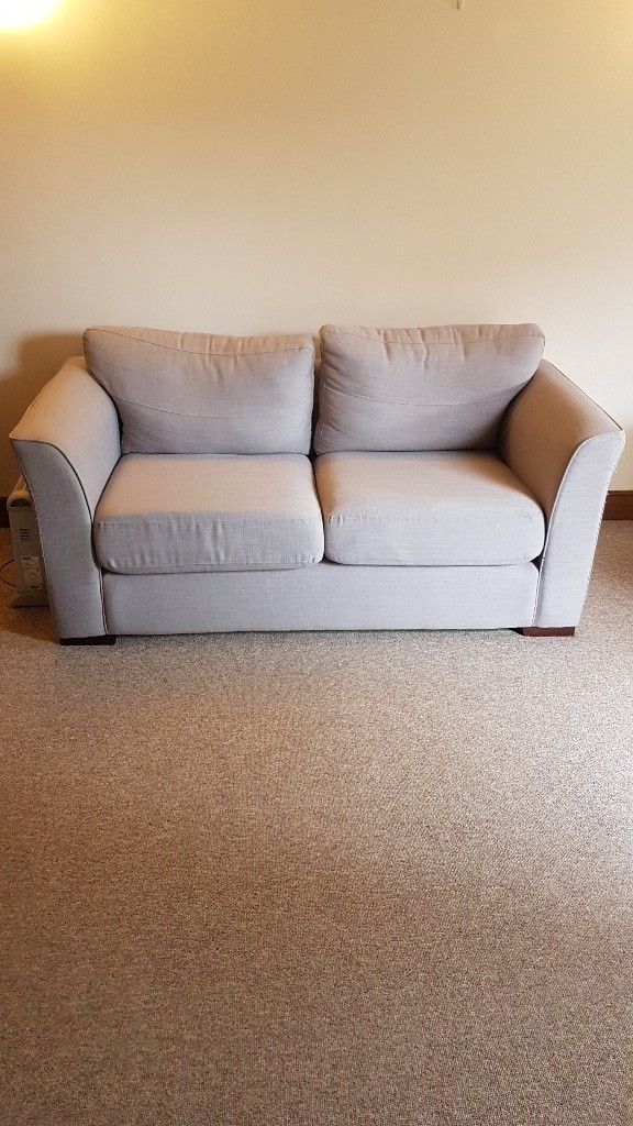 light grey 2 seater sofa. Very clean, no marks or stains etc. in