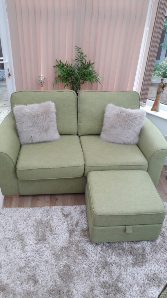 DFS green fabric two seater sofa with storage footstool. Excellent condition. in Chesterfield