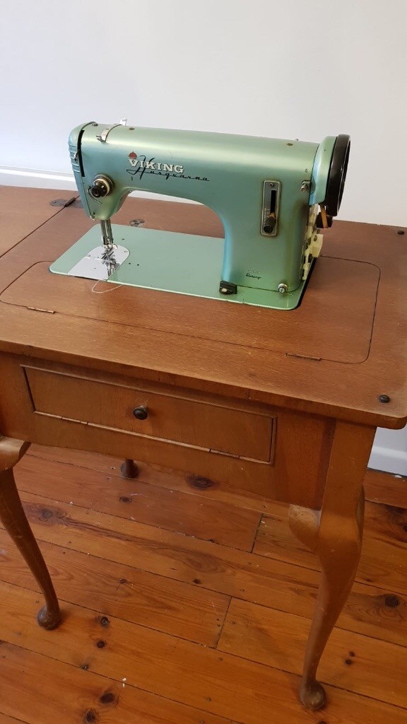 Vintage Viking Husqvarna sewing machine with integrated table in