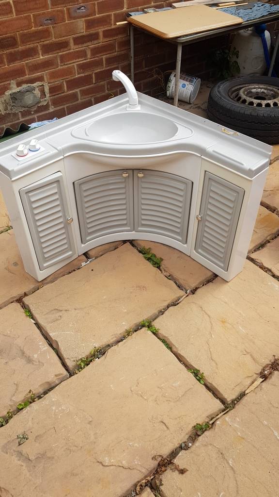 Tourer caravan bathroom sink in vanity unit with whale taps in
