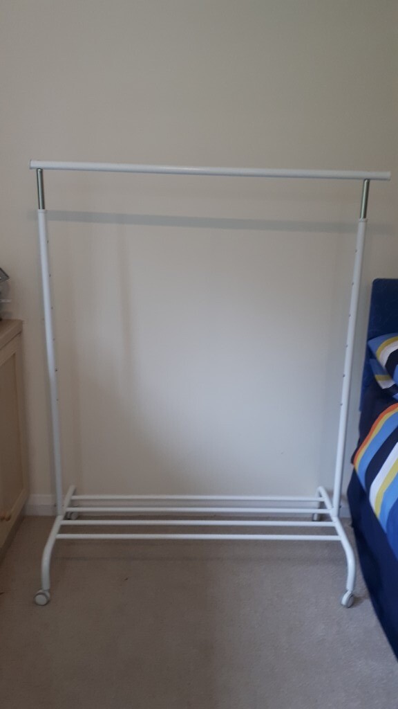 Free standing, adjustable, portable, white, metal clothes rail with