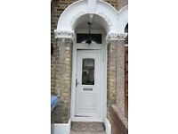 White UPVC front door and frame, with 2 keys