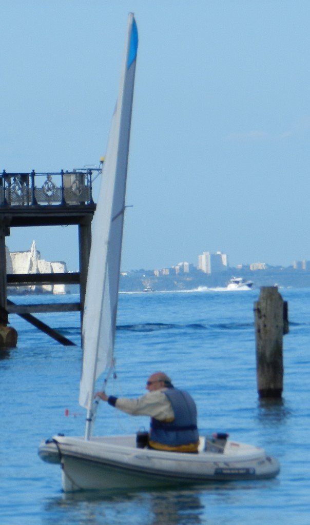 Walker Bay 10 sailing dinghy with floatation tubes and trolley in