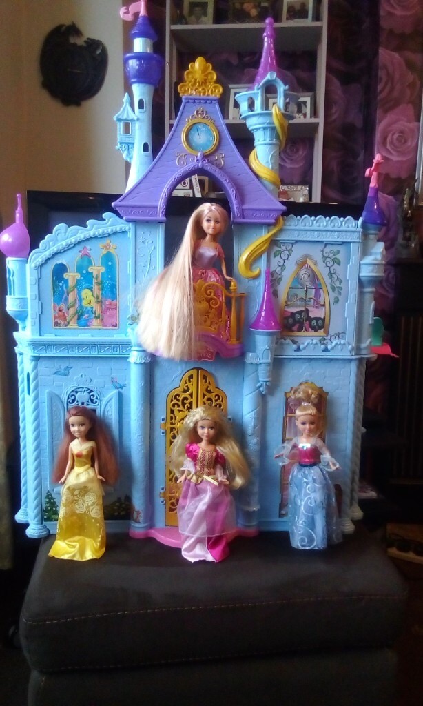 Disney / Barbie castle with furniture and four dolls in Heanor