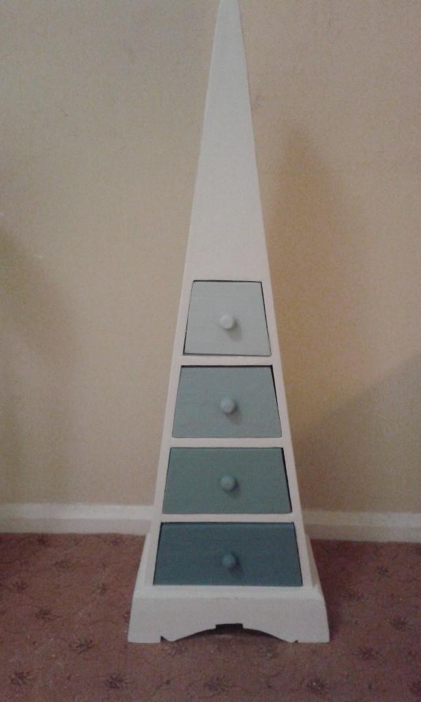 Unique triangular white wooden chest of drawers with blue ombre drawers