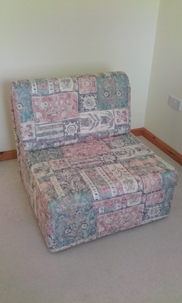 Futon Chair/Fold out Single Bed. Blue/Pink patterned material. in