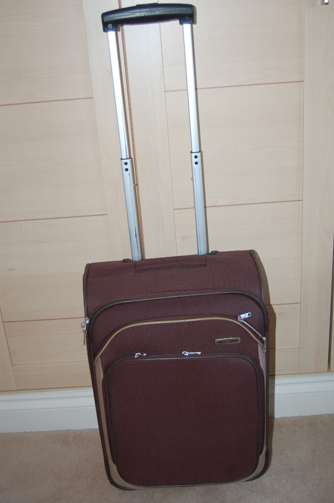 tiny suitcase on wheels