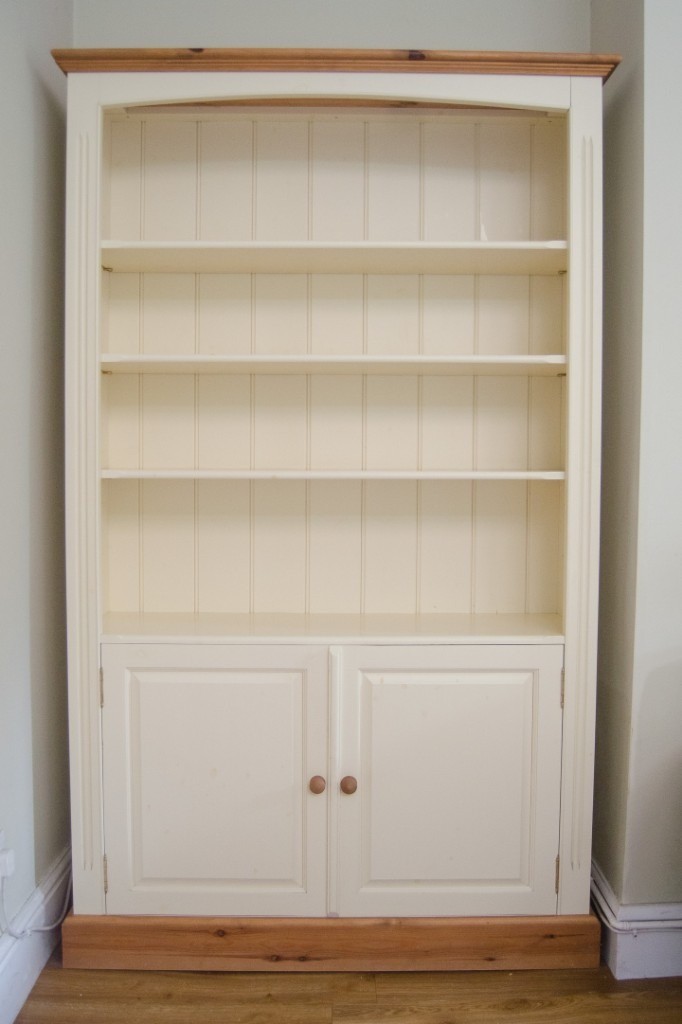 Cream wooden bookcase with cupboard in West Bridgford