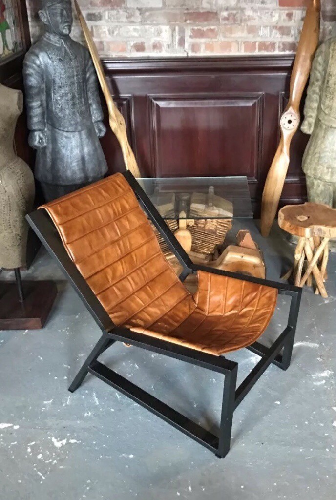 Rustic metal frame industrial style tan leather lounge chairs
