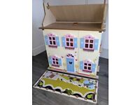 Wooden dolls house with characters