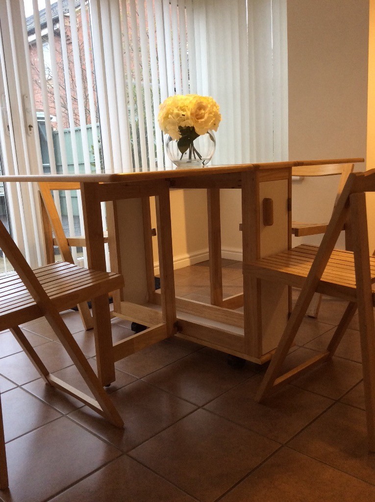 Pine and white fold down table with 4 chairs in Corby 