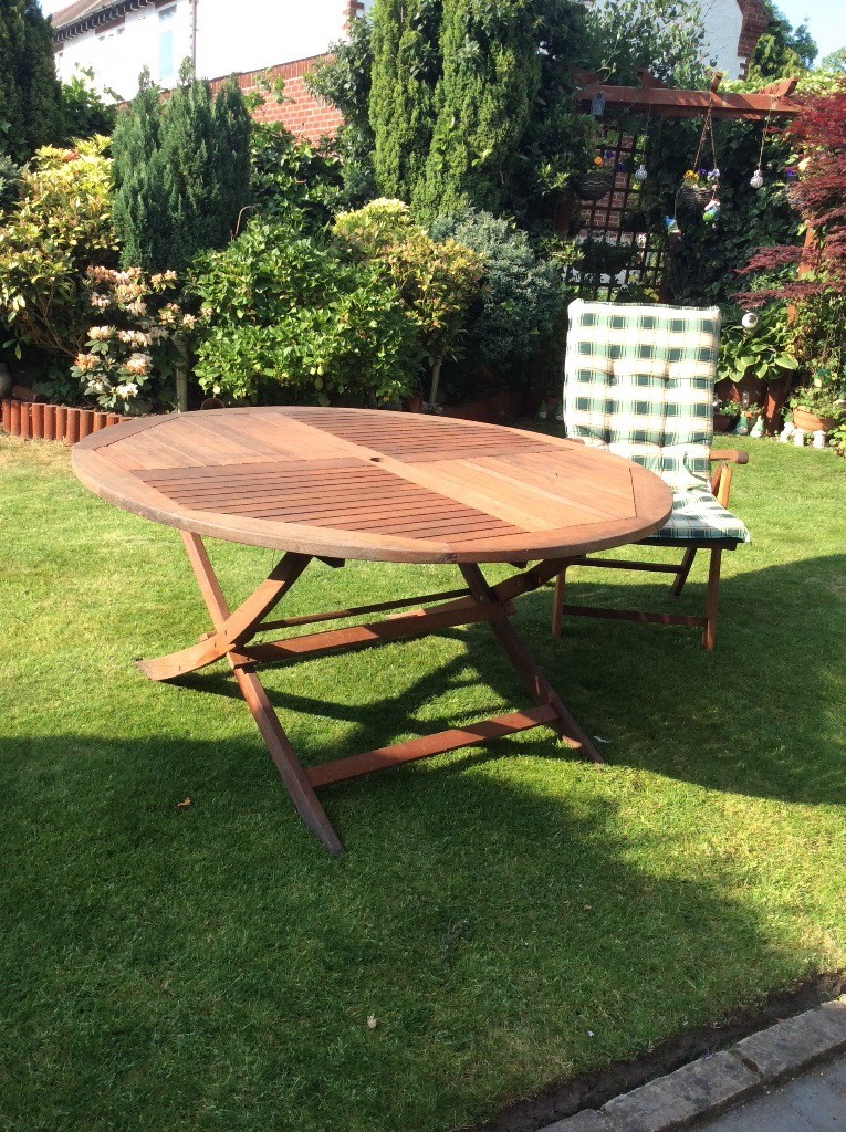 Hard wood round garden table with 6 reclining chairs and extra thick