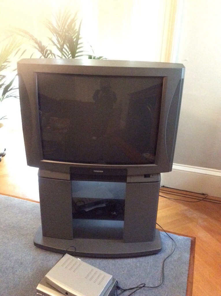 TV, with stand, vhs player, free view box, numerous VHS tapes, speakers