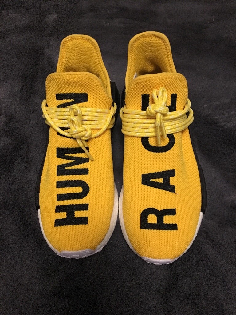 yellow human race trainers