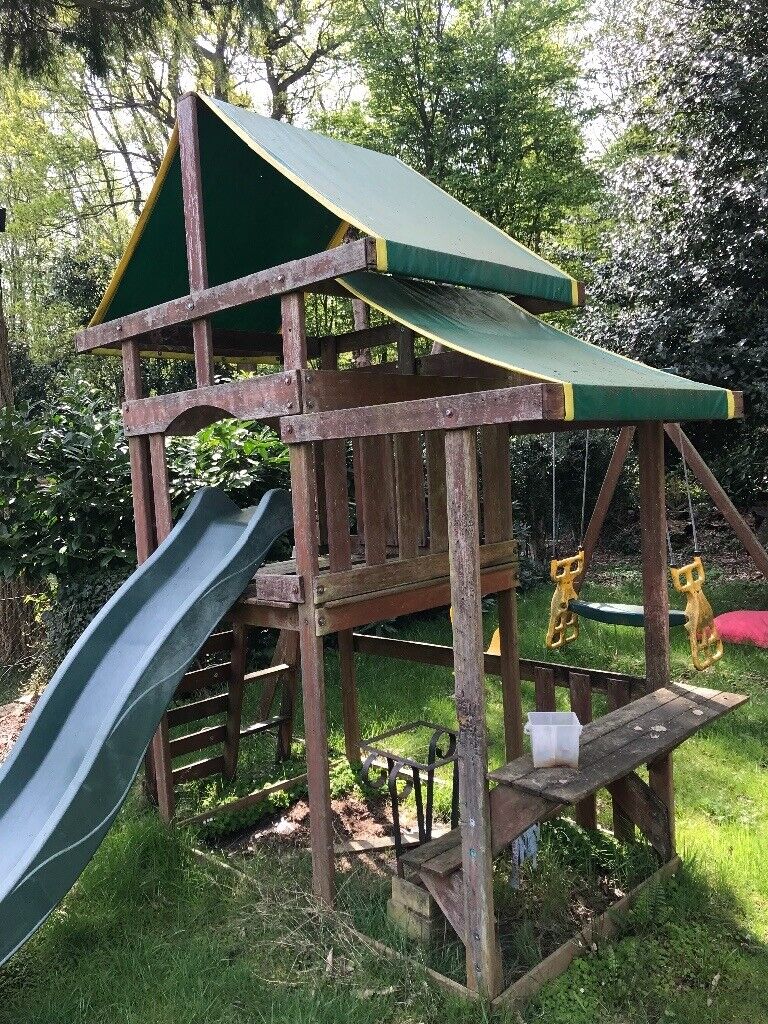 Wooden treehouse with slide  swings and seesaw in Hutton Essex Gumtree