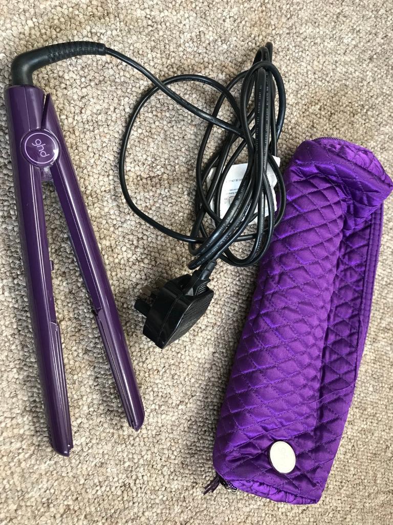 GHD hair straighteners with heat resistant purple padded case in