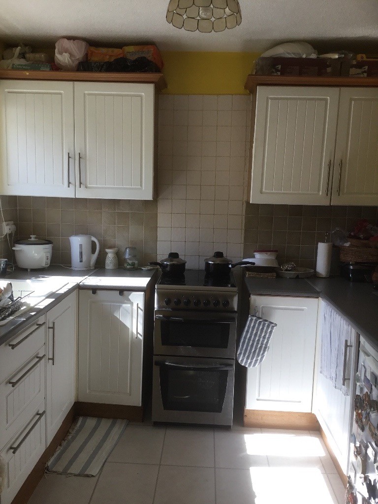 Used kitchen units in white. Grey worktop and tiles ...