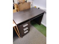 Dark wood desk with drawers