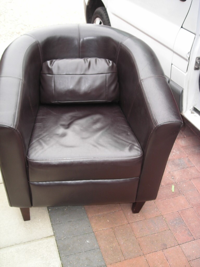 Round retro tub chair in black leatherette with support cushion in