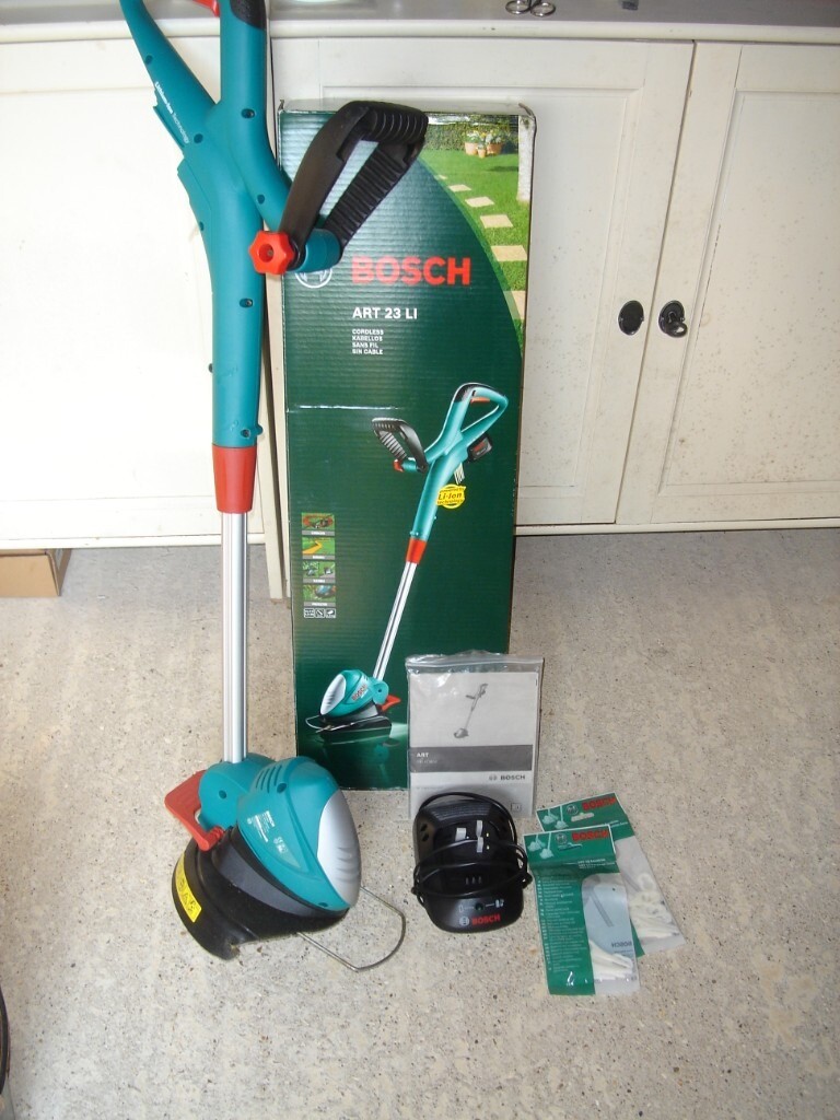 Bosch cordless battery strimmer with Battery and charger, blades etc. in Downham Market