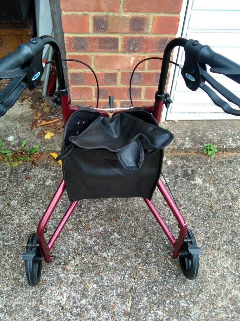 mobility aid 'DAYS' 3 wheel red colour walker with small bag. in St