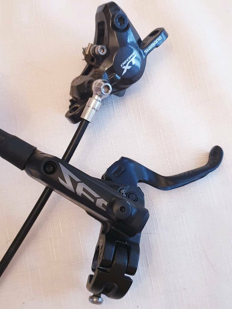 Shimano Deore XT M8000 front brake caliper with Zee lever and reservoir